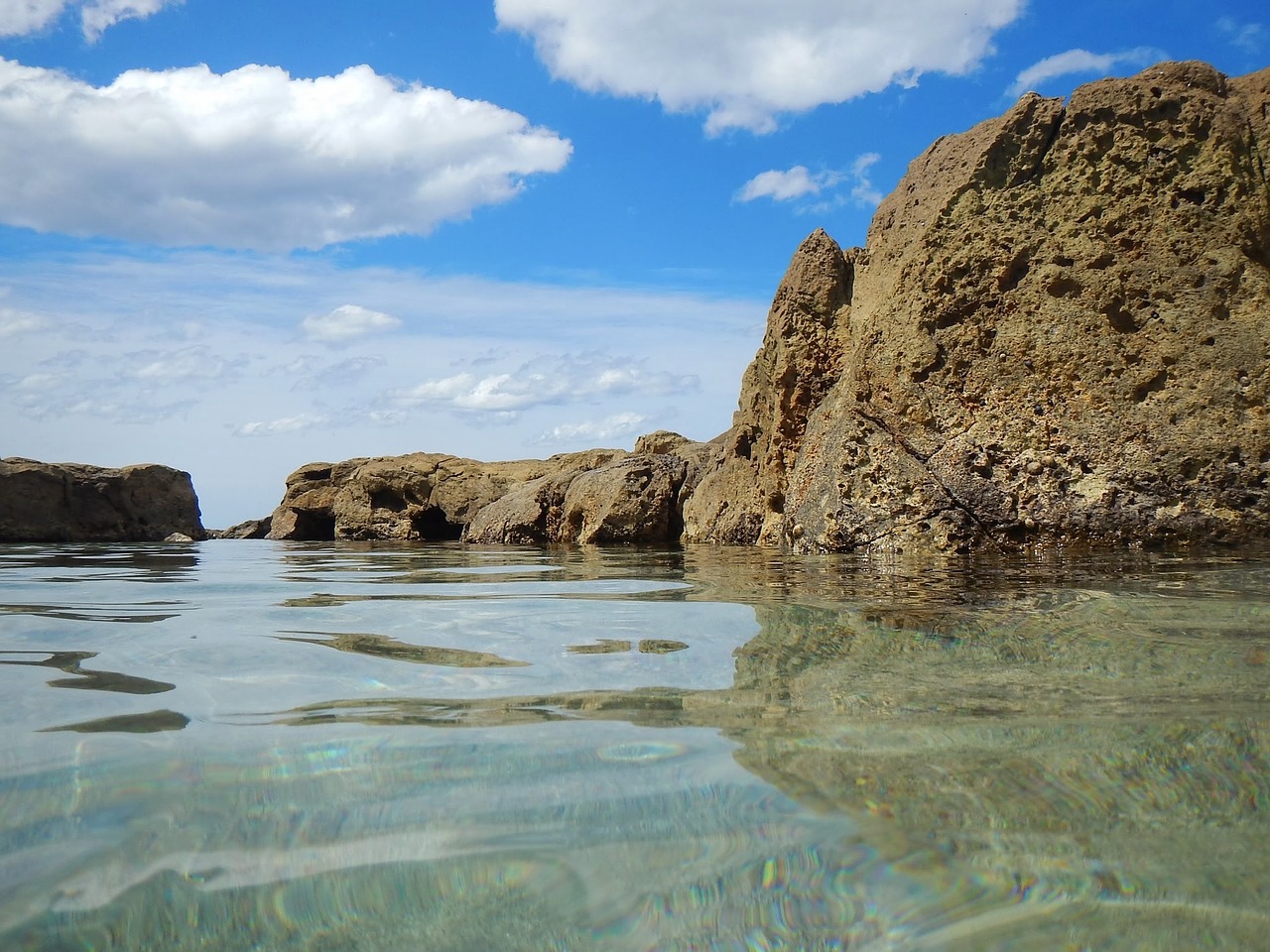 sea rocks clouds free photo