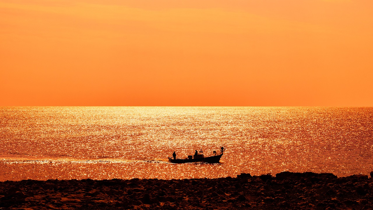 sea boat sunset free photo