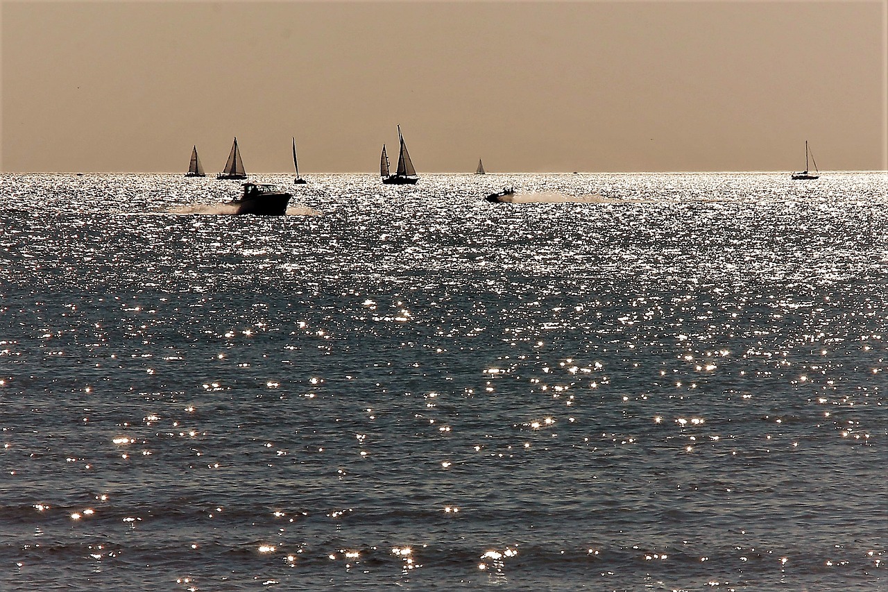 sea boats sunset free photo