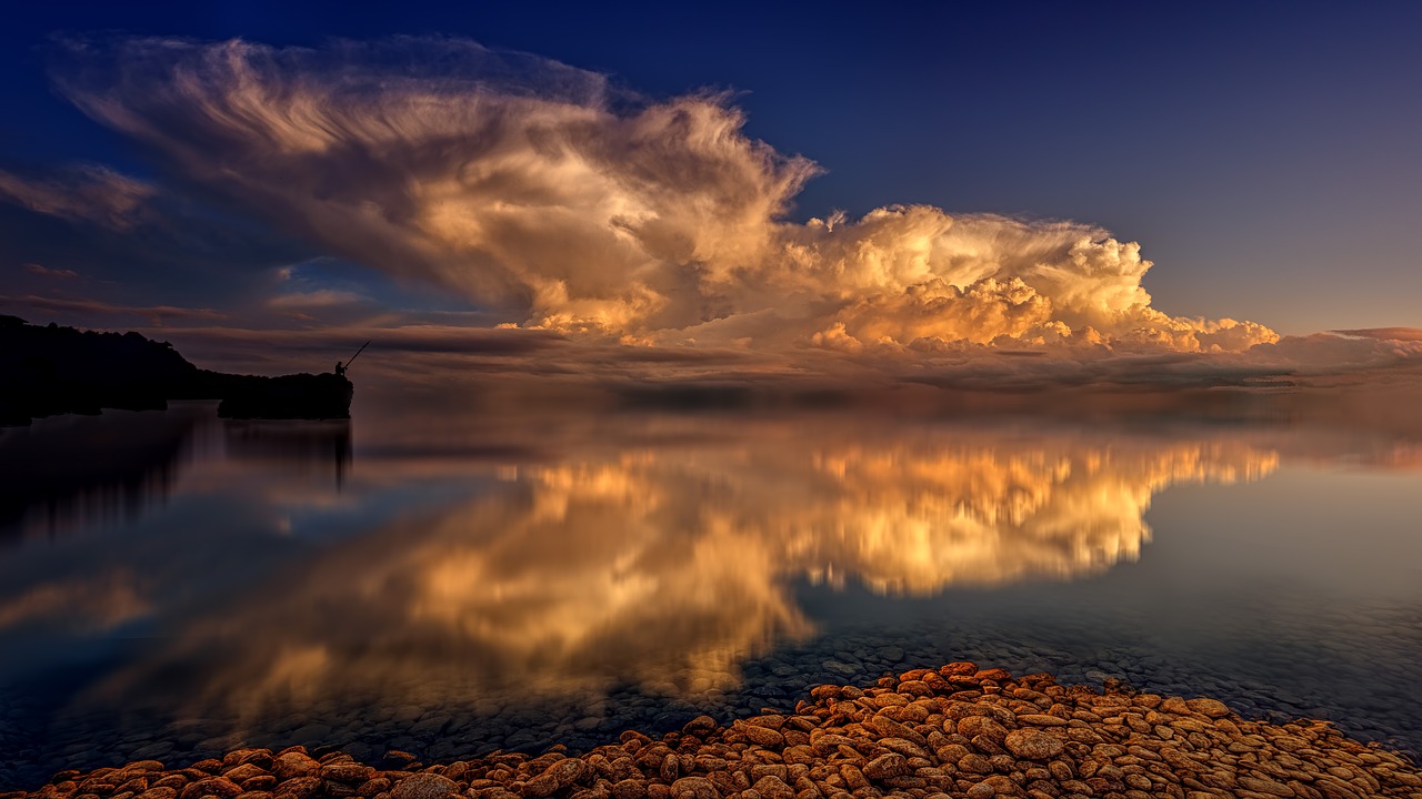 sea  mirroring  clouds free photo