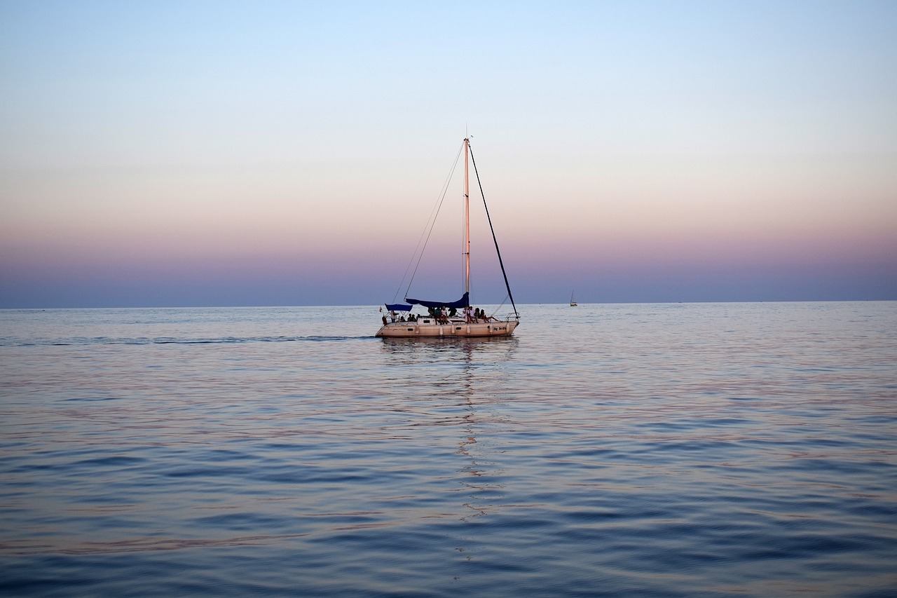 sea  boat  sunset free photo