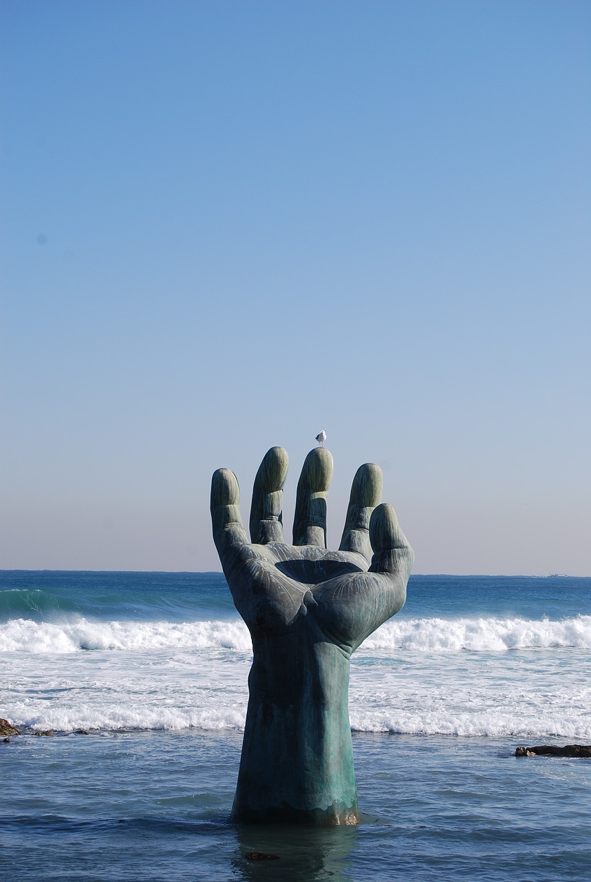 sea hand sculpture free photo