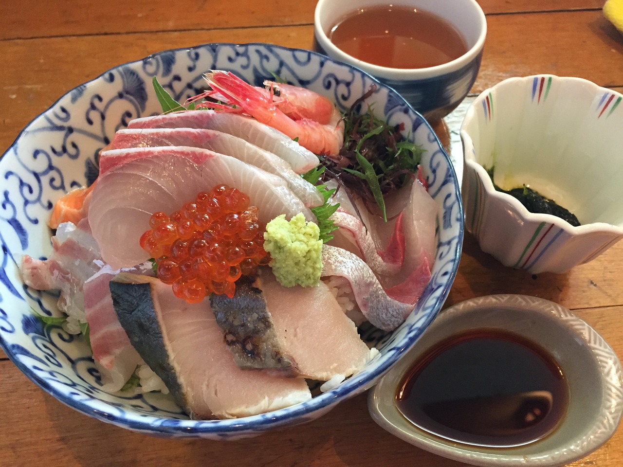 seafood bowl of rice topped with sashimi japan food free photo
