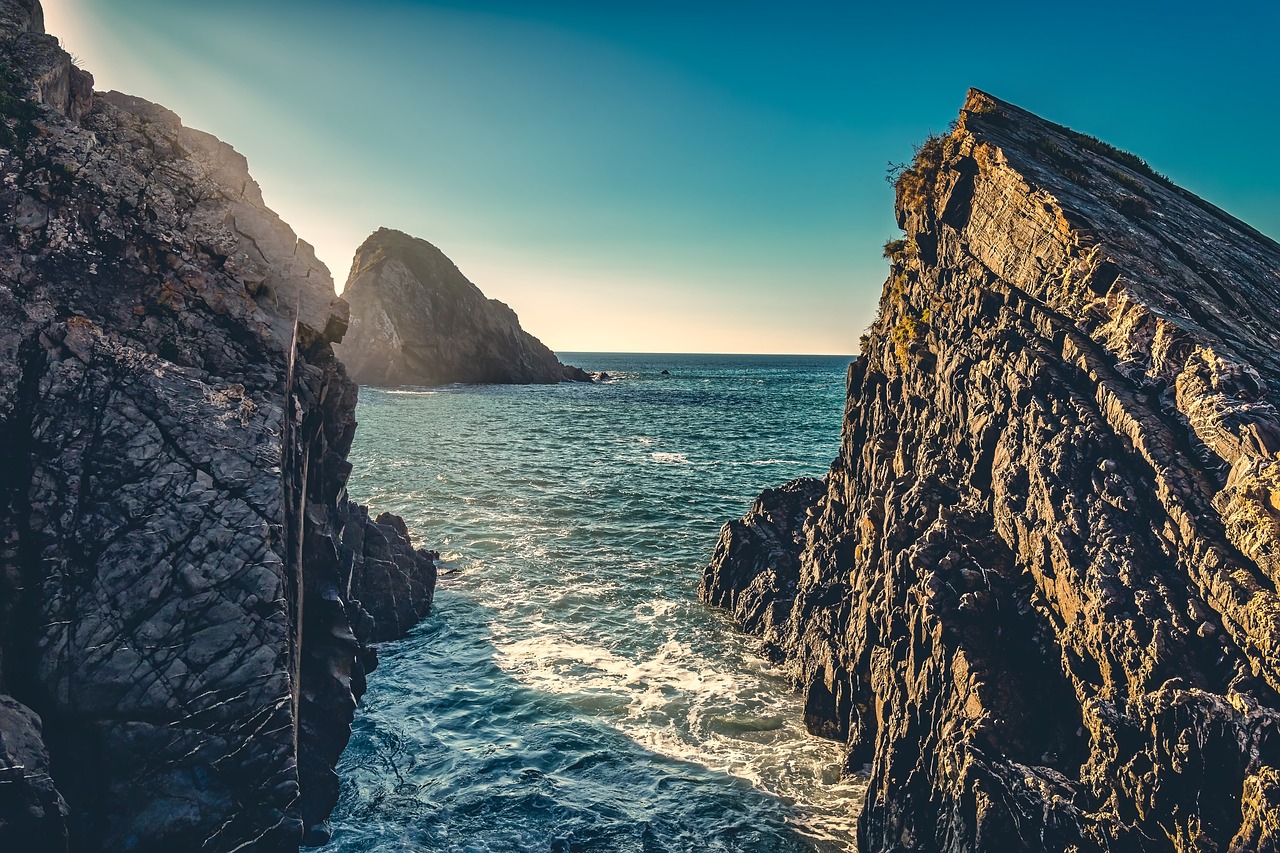 seaside  cliffs  sunbeams free photo