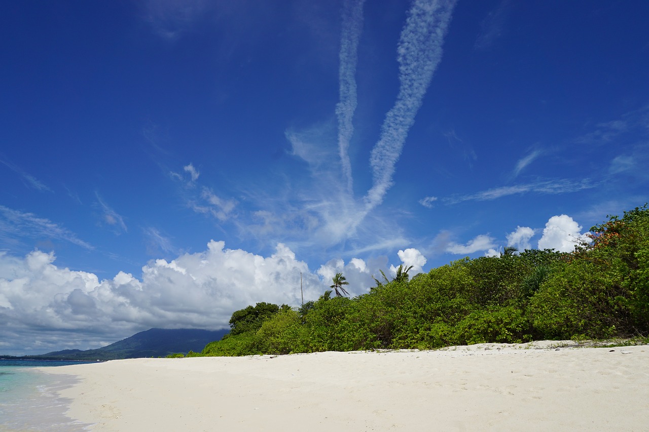 secluded beach clear blue sky quiet white sand beach free photo