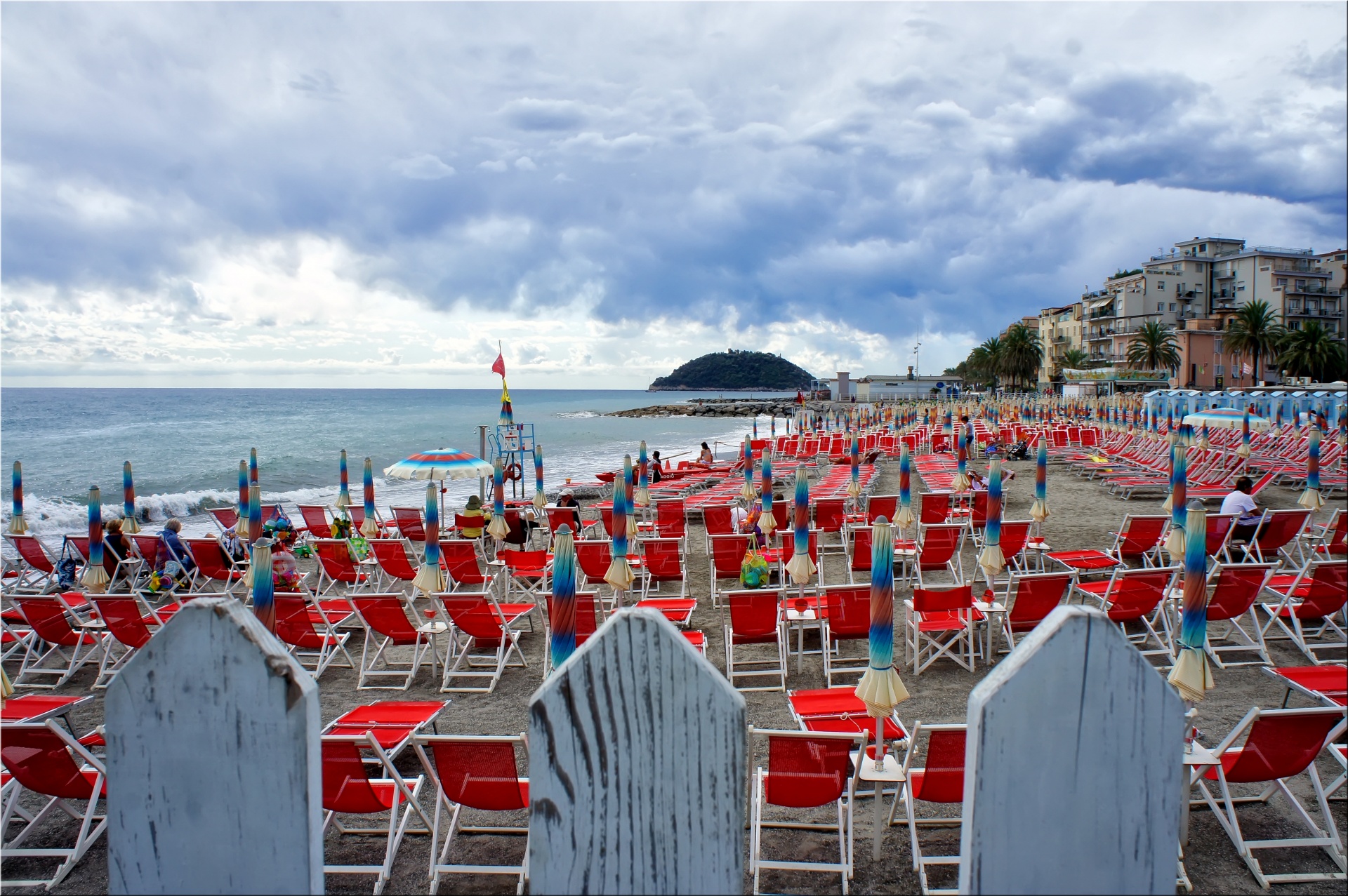 deck chairs clouds beach free photo