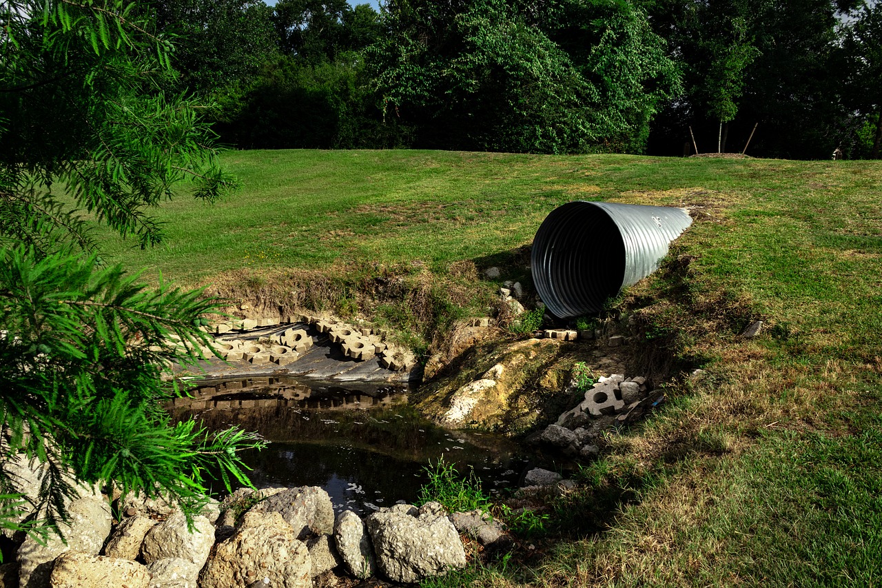 sewage pipe polluted water  environmental  erosion free photo