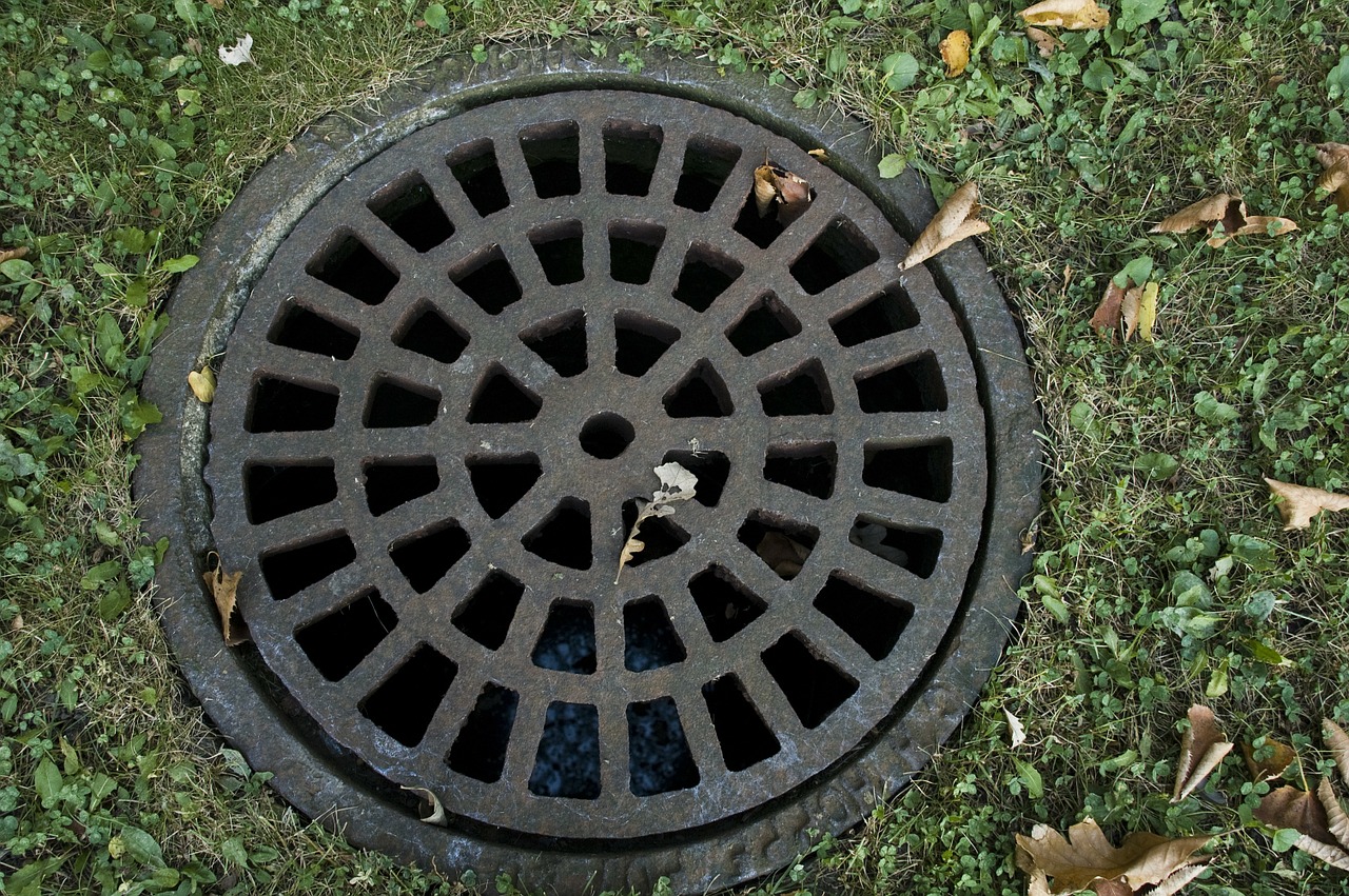 sewer cover iron grate steel free photo