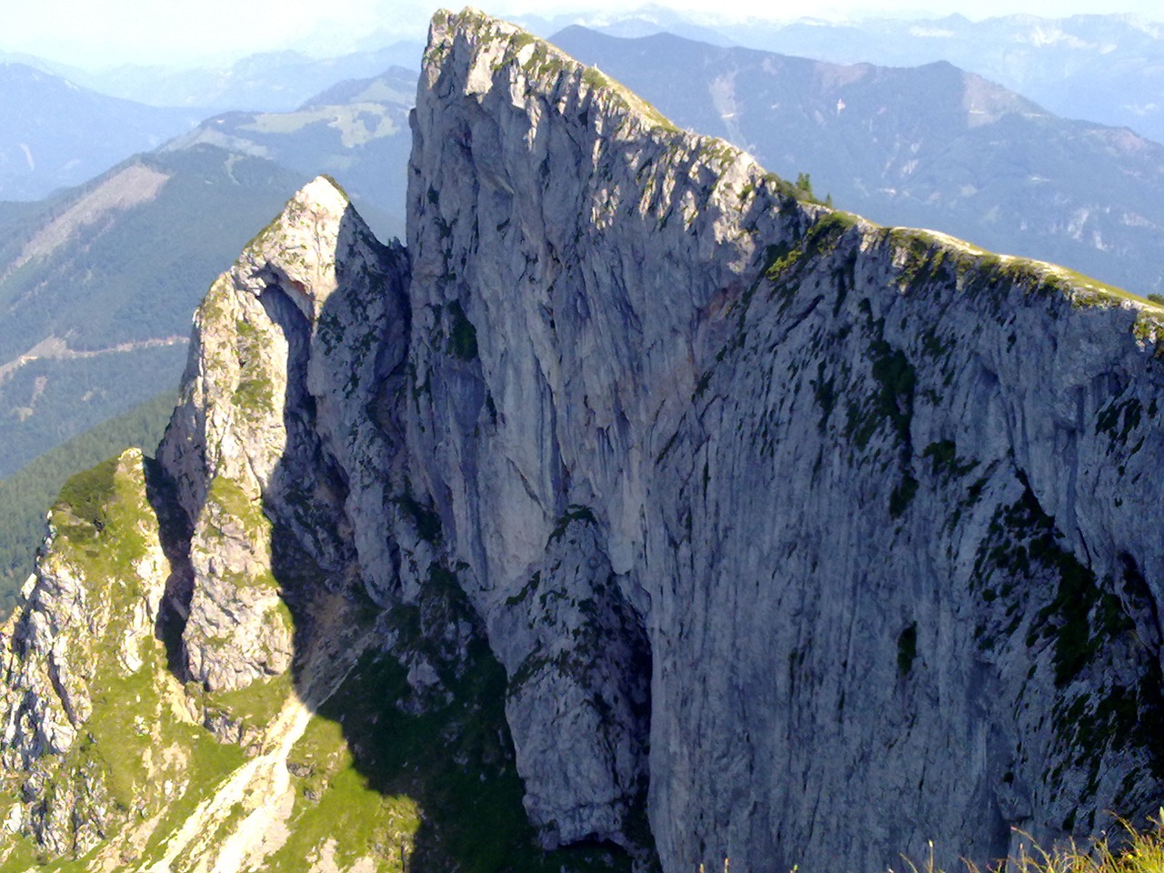 sheep mountain steep rock wall panoramic view to the lake free photo