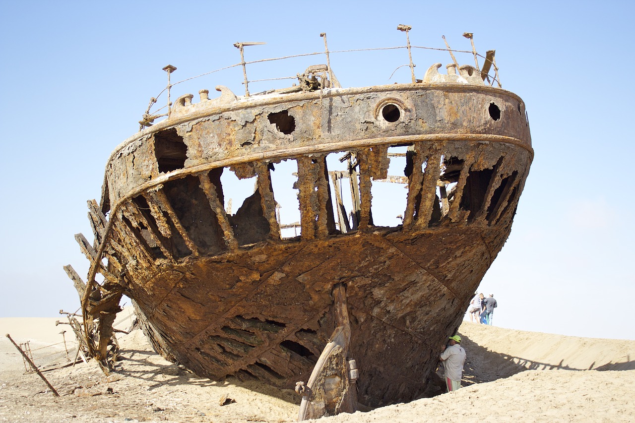 shipwreck  sand  coast free photo