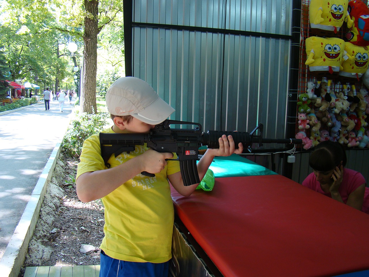 shooting gallery attraction boy free photo