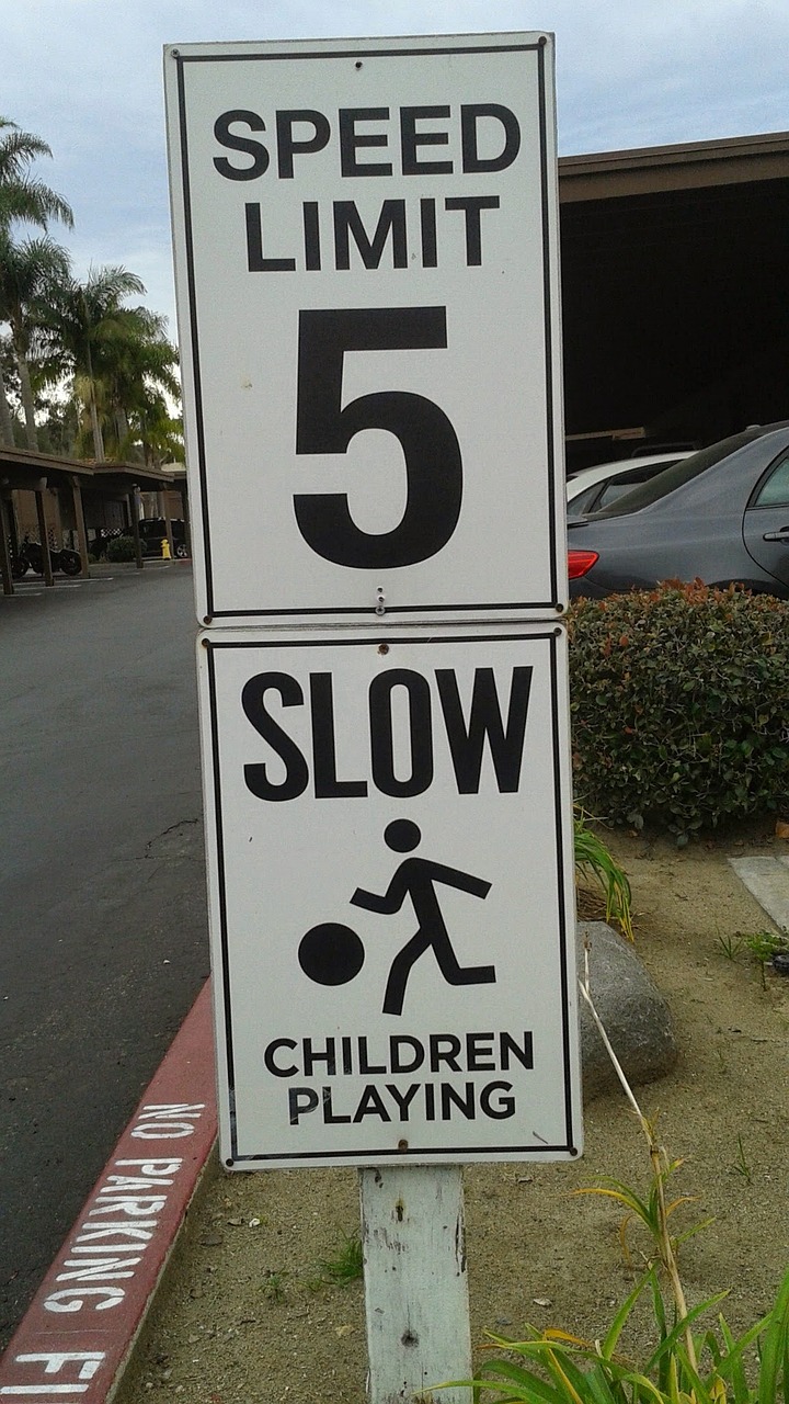 sign speed limit slow children playing free photo
