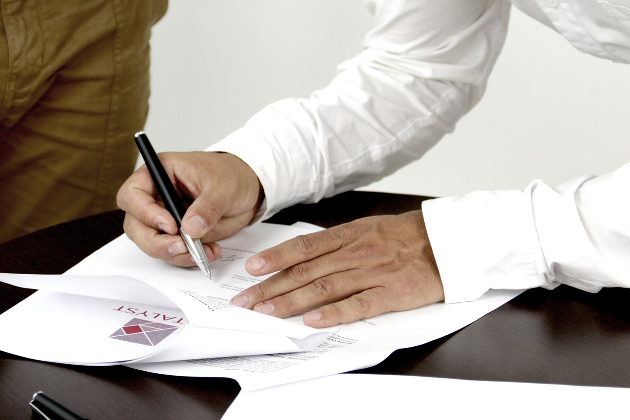 signature contract person signing a document free photo