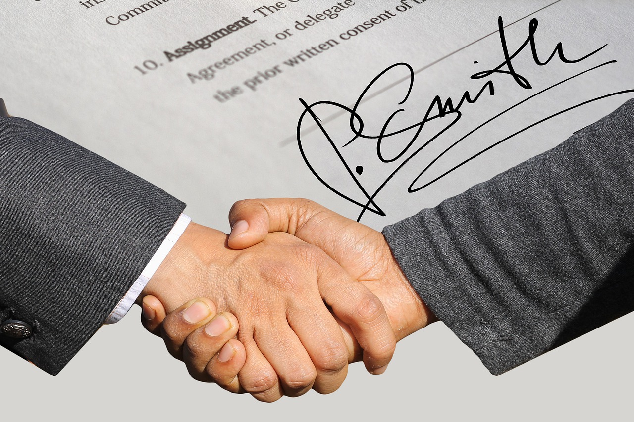 signature contract shaking hands free photo