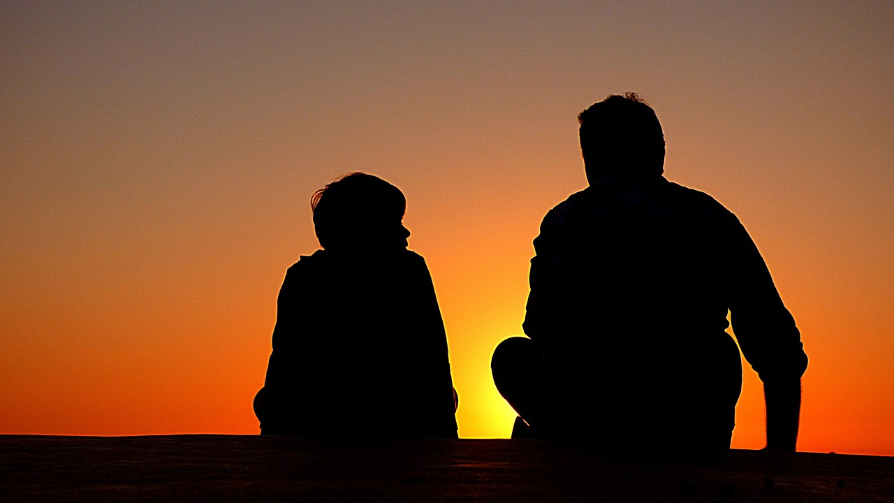 silhouette father and son sundown free photo