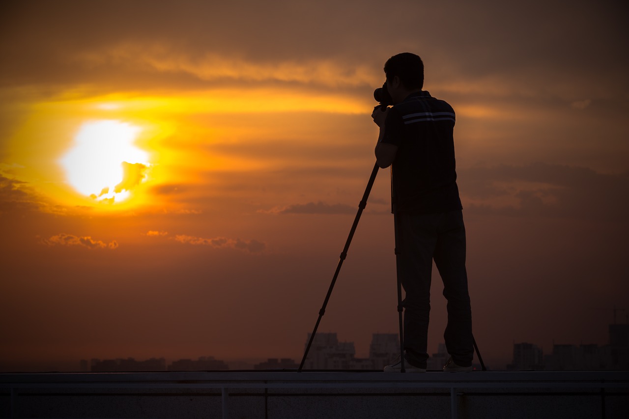 silhouette shooting sunset free photo