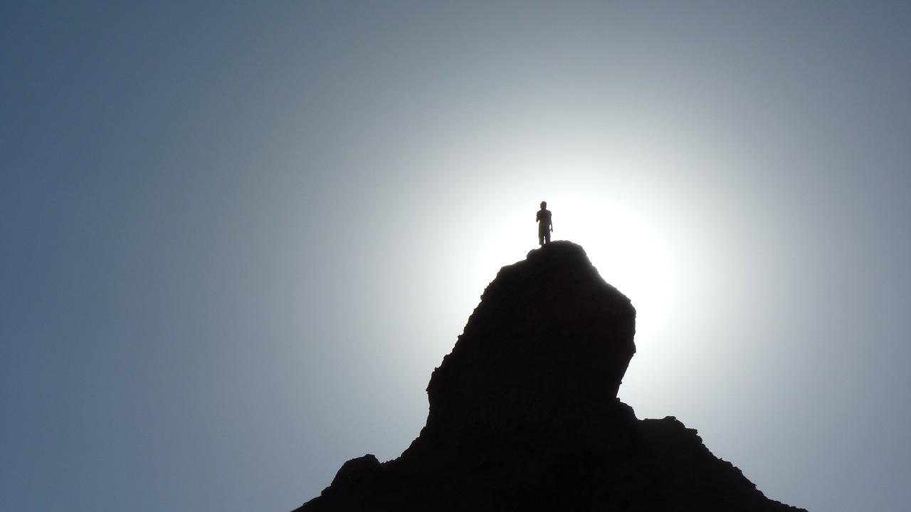 silhouette hiker mountain top free photo