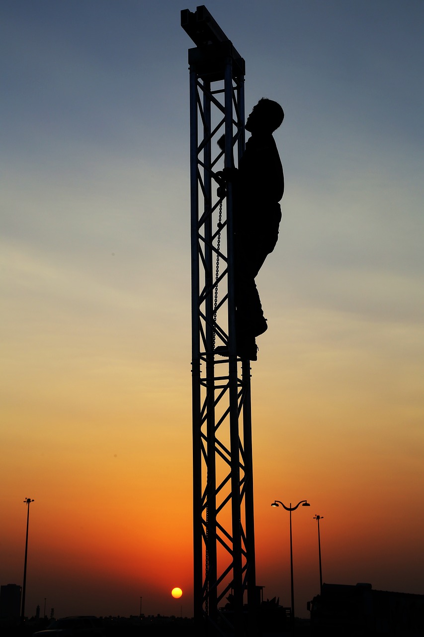 silhouette teamwork  trust  climbing free photo