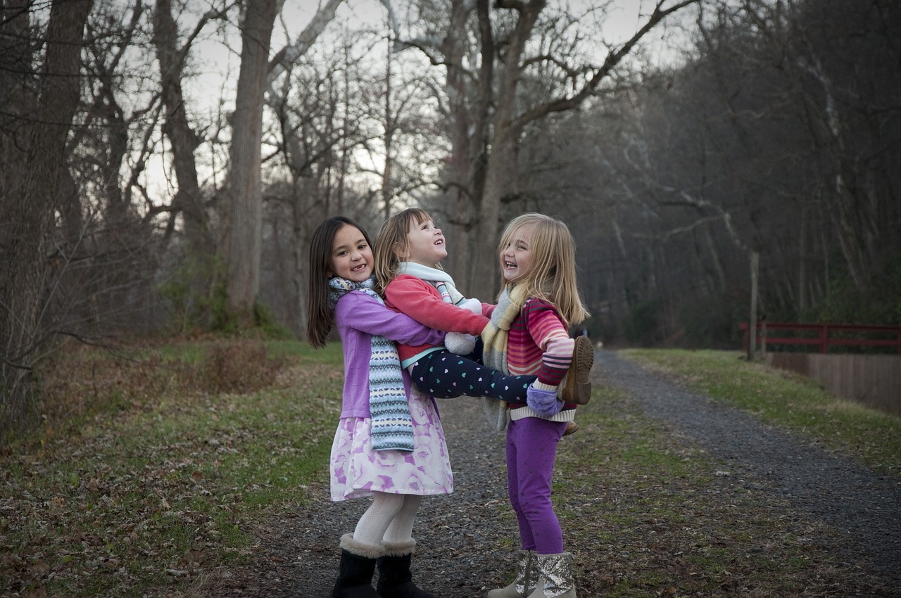 sisters holding path free photo