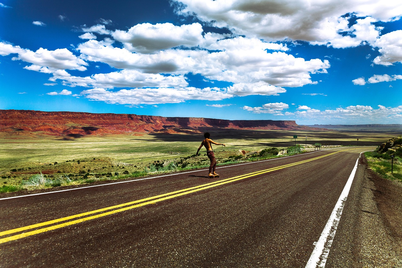 skateboarder rural road free photo