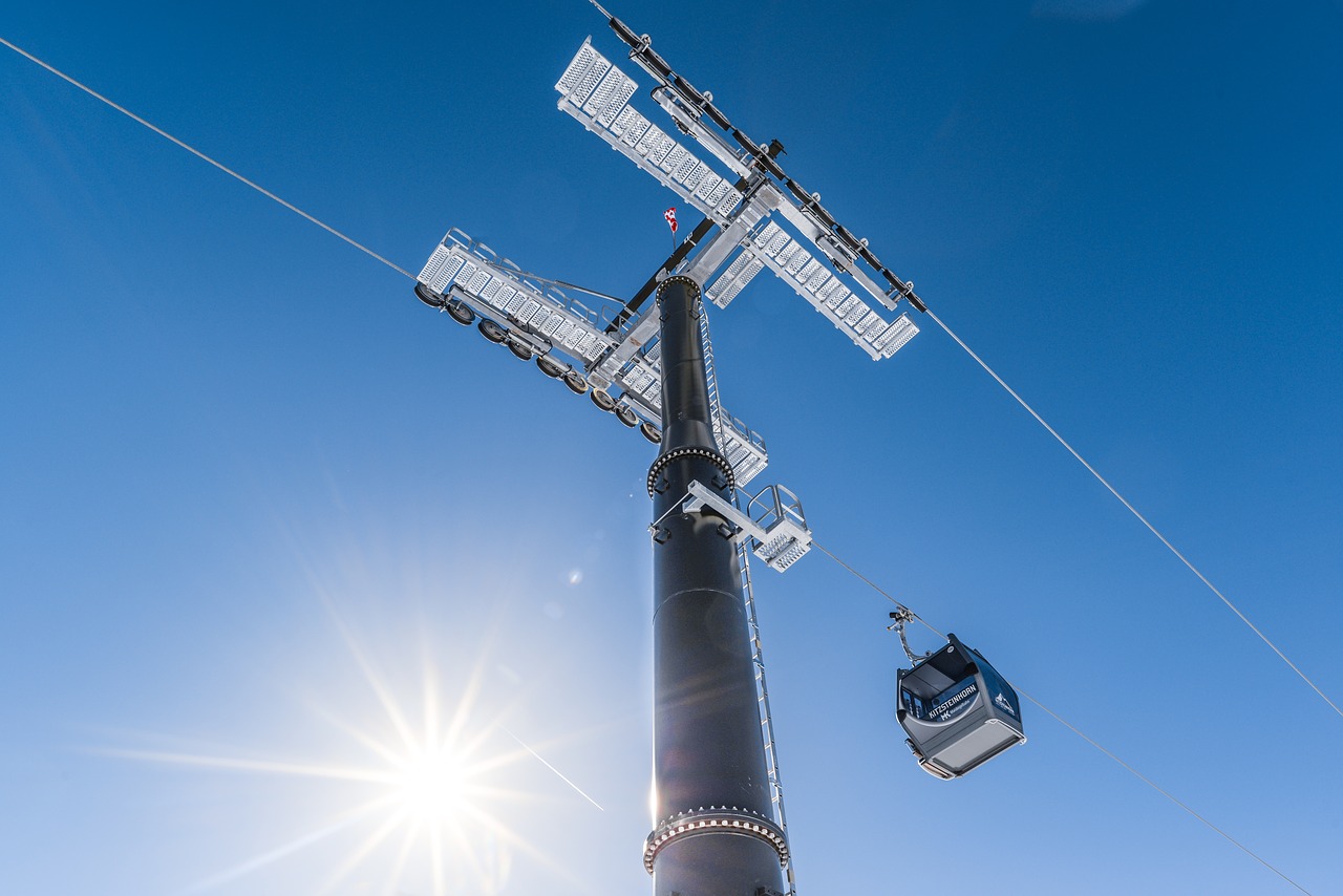 ski lift  sunstar  blue sky free photo