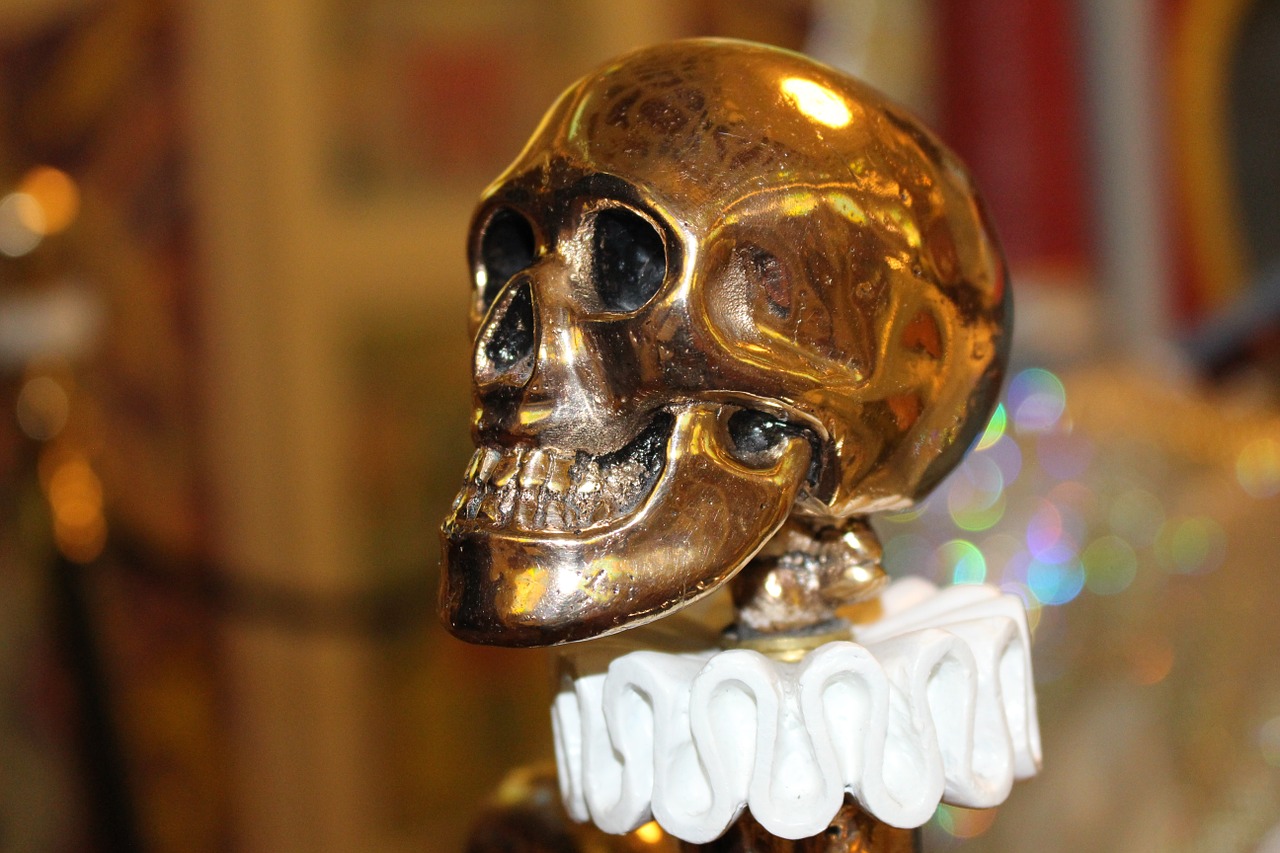 skull and crossbones gold object free photo