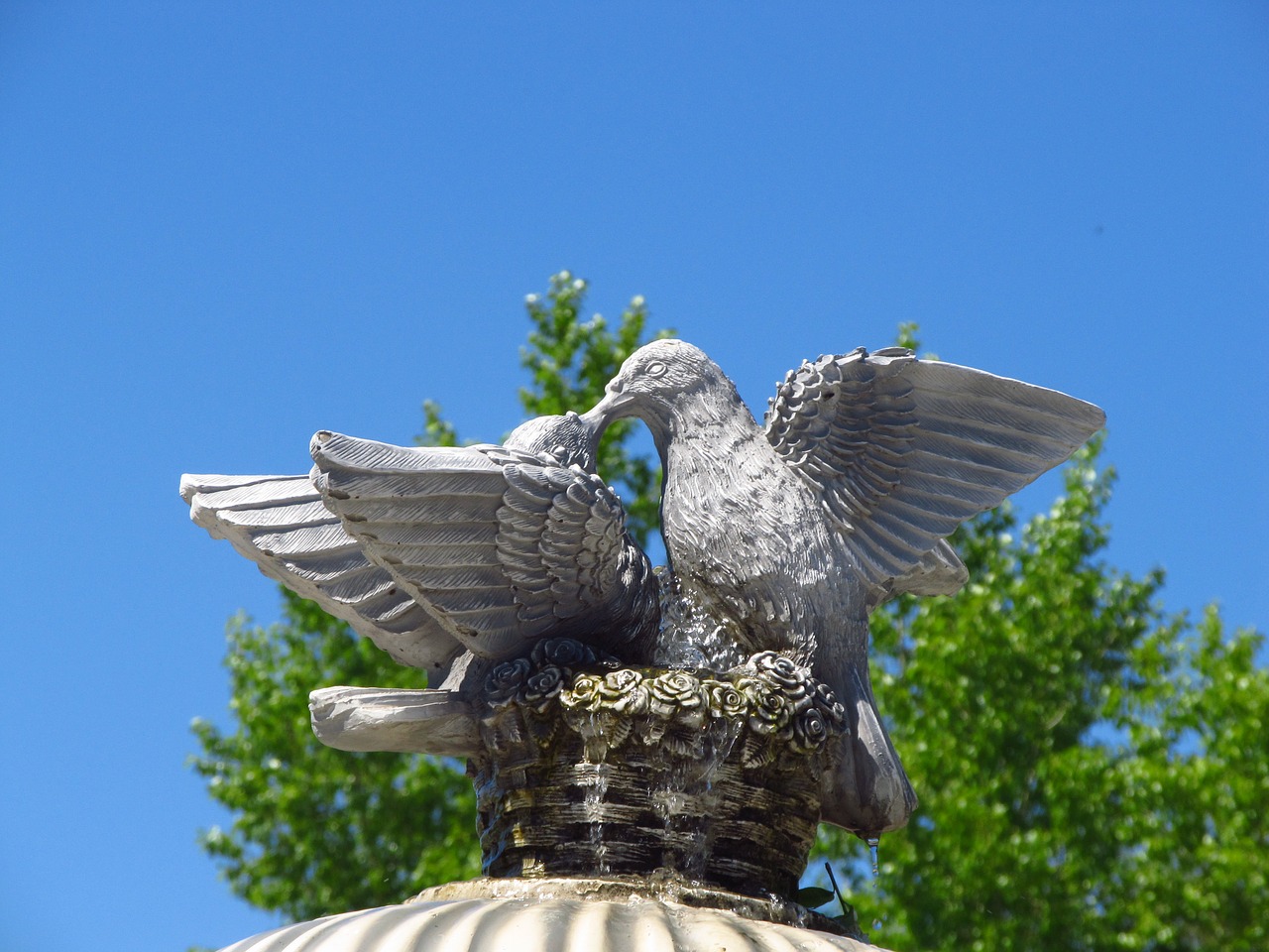 sky fountain stone doves free photo