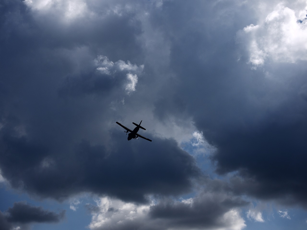 sky aircraft dark clouds free photo