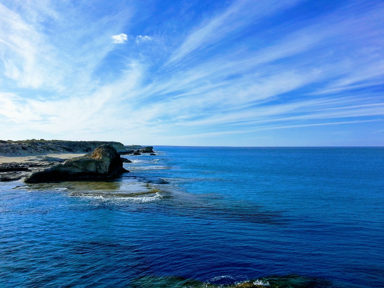 sky rocks sea free photo