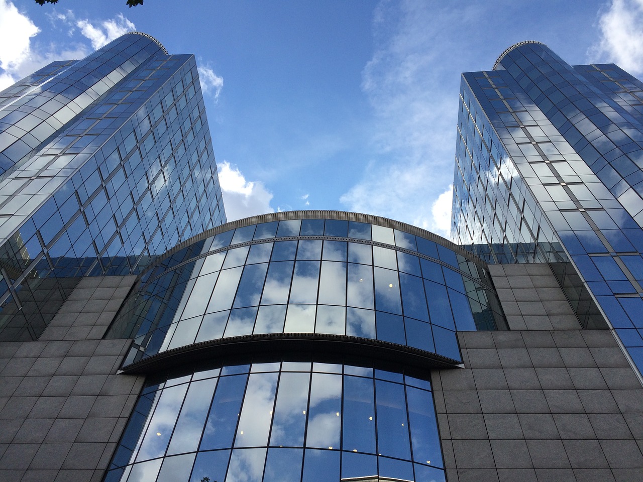 sky building mirrored the european parliament free photo