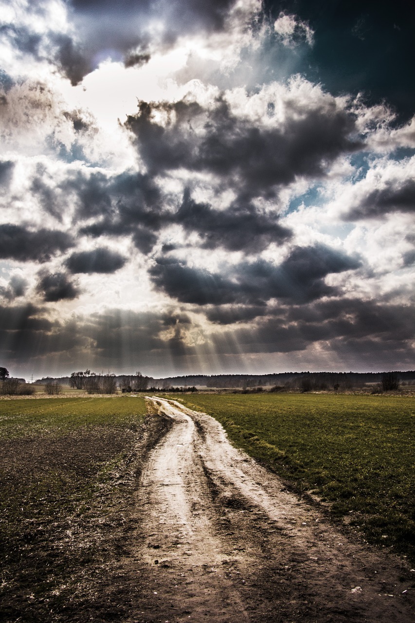 sky clouds dirt road free photo