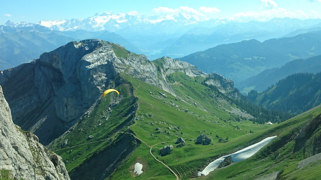 skydiver mountains landscape free photo