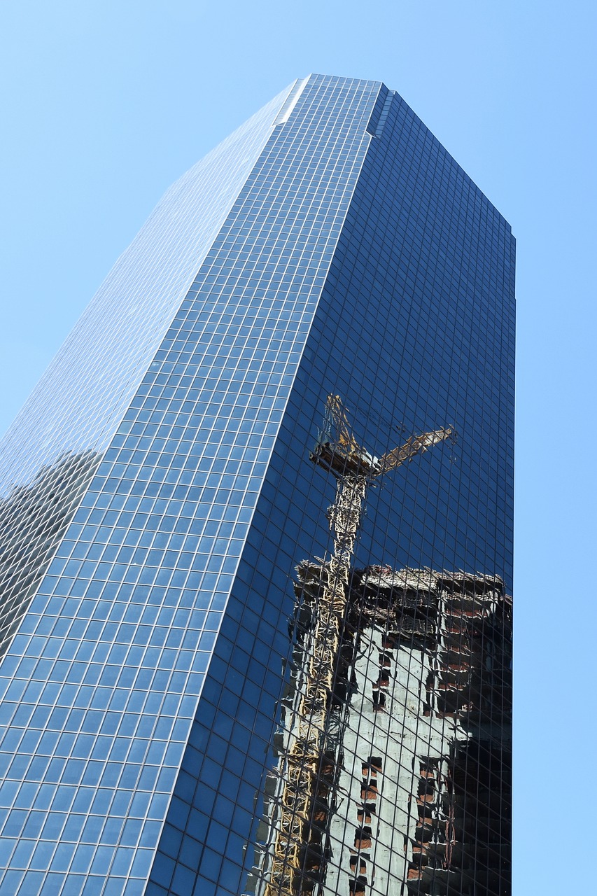 skyscraper  baukran  mirroring free photo