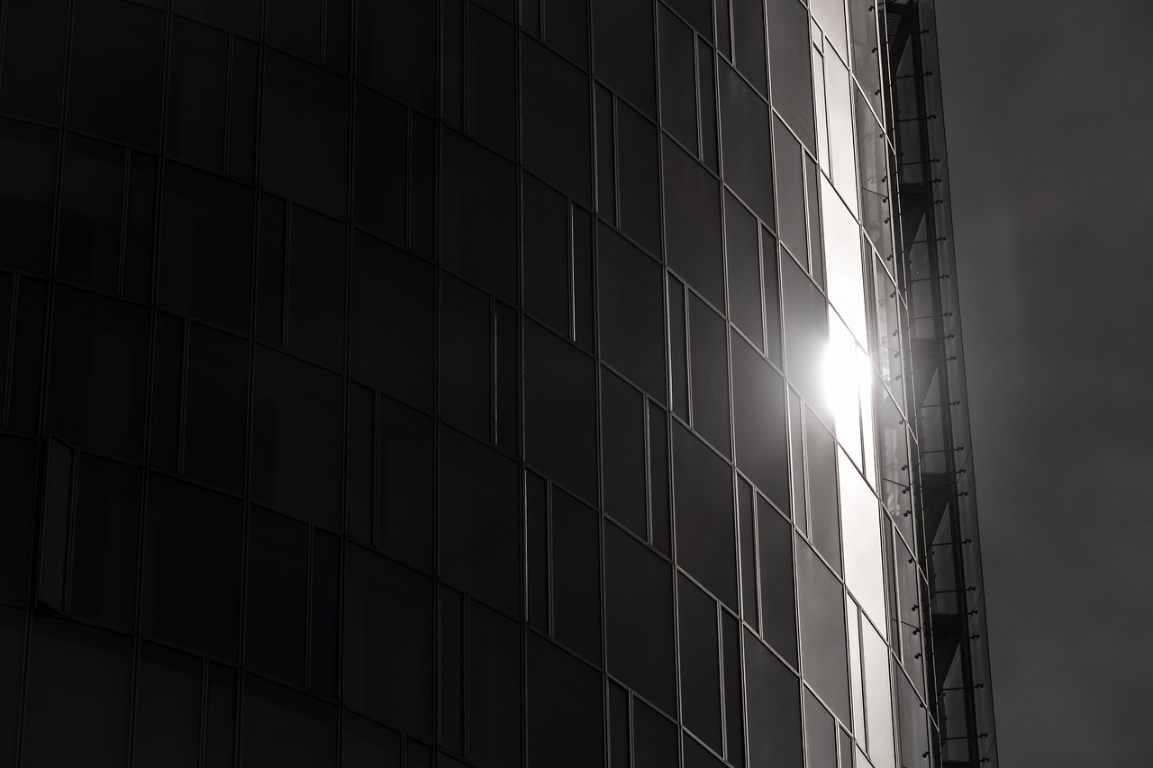 skyscraper  reflection  glass facade free photo