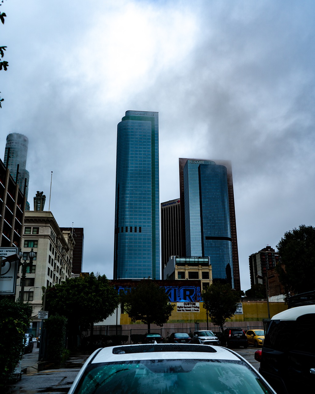 skyscraper  rainy  cloudy free photo