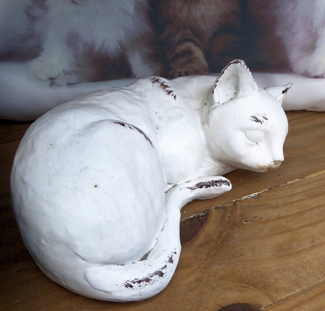 sleeping cat painted clay outdoors free photo