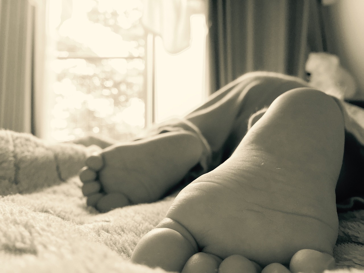 sleeping child feet window free photo