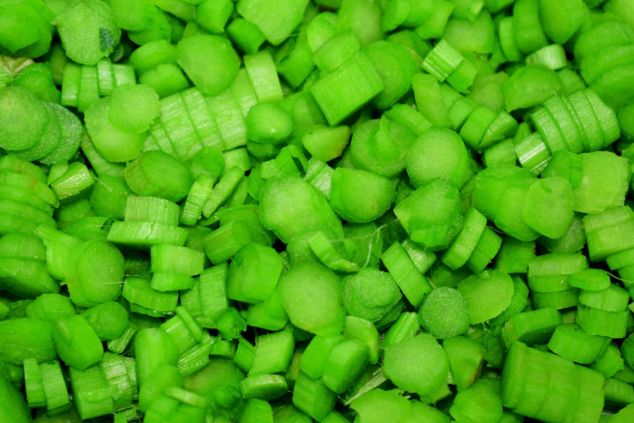 sliced vegetable green background vegetable free photo