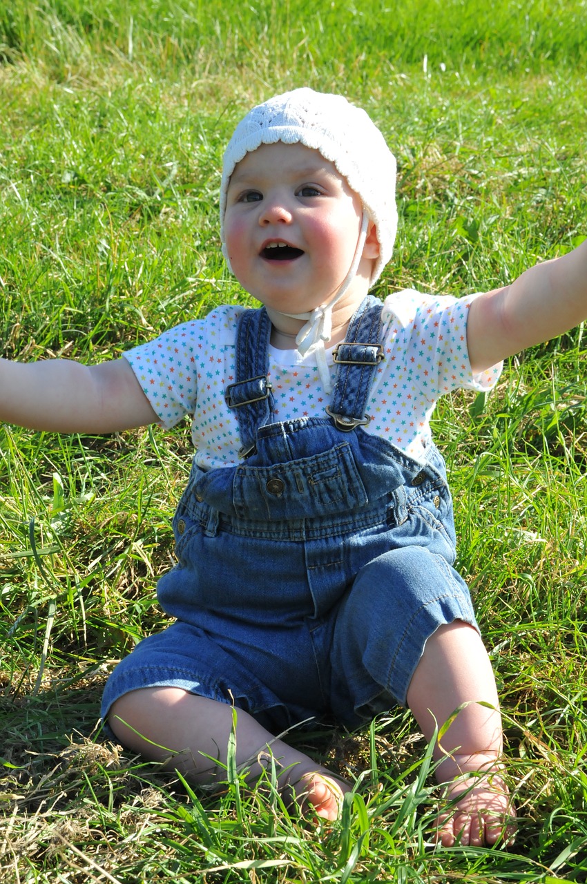small child arms raised meadow free photo