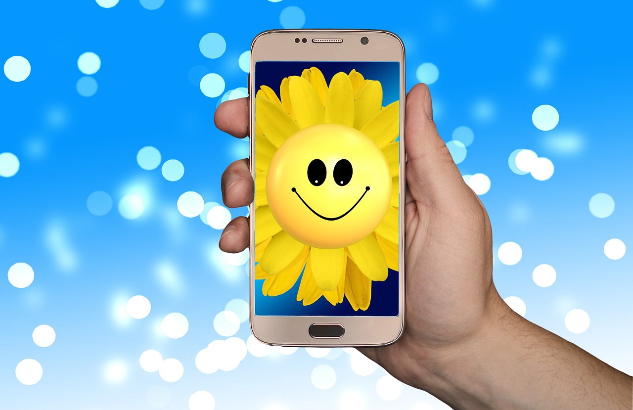 smartphone  sunflower  smilie free photo