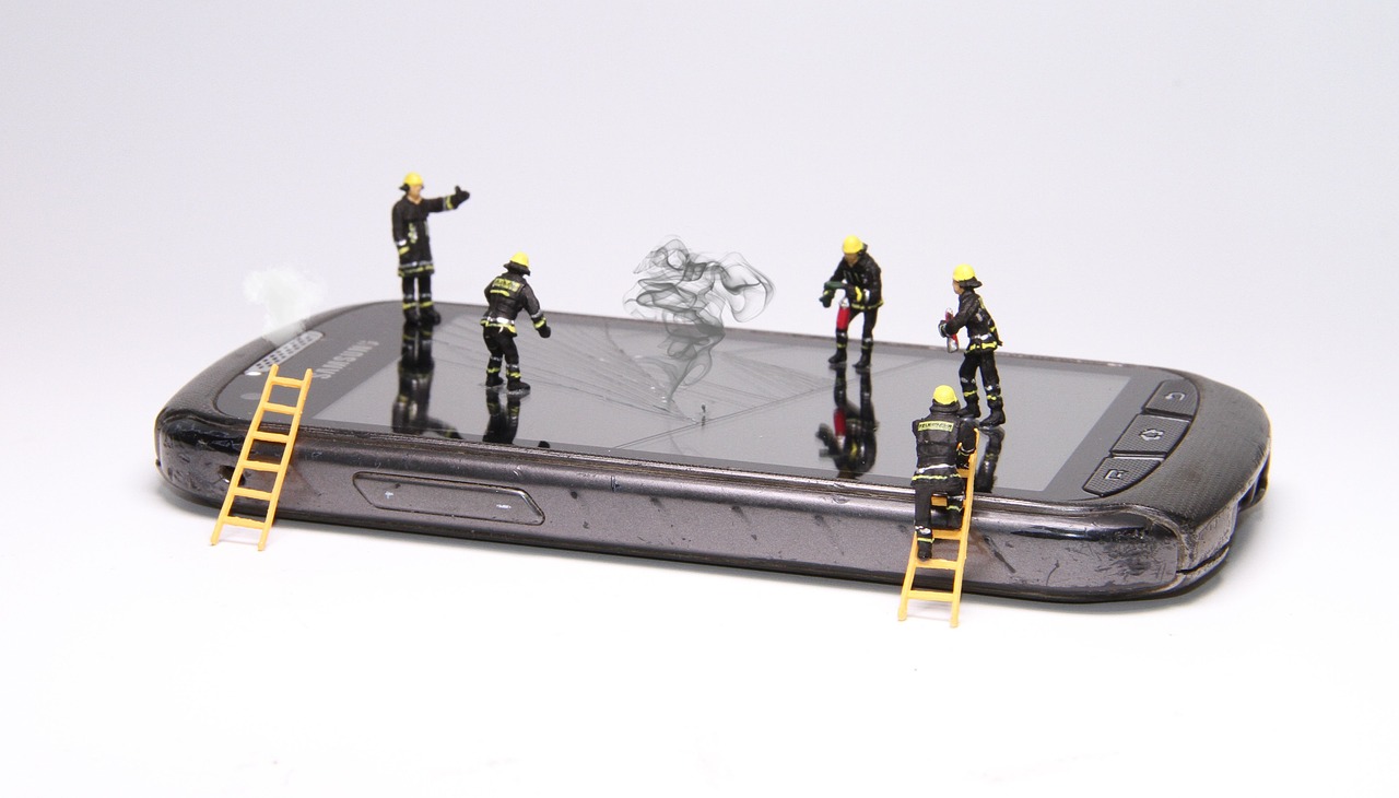 smartphone  fire  miniature figures free photo