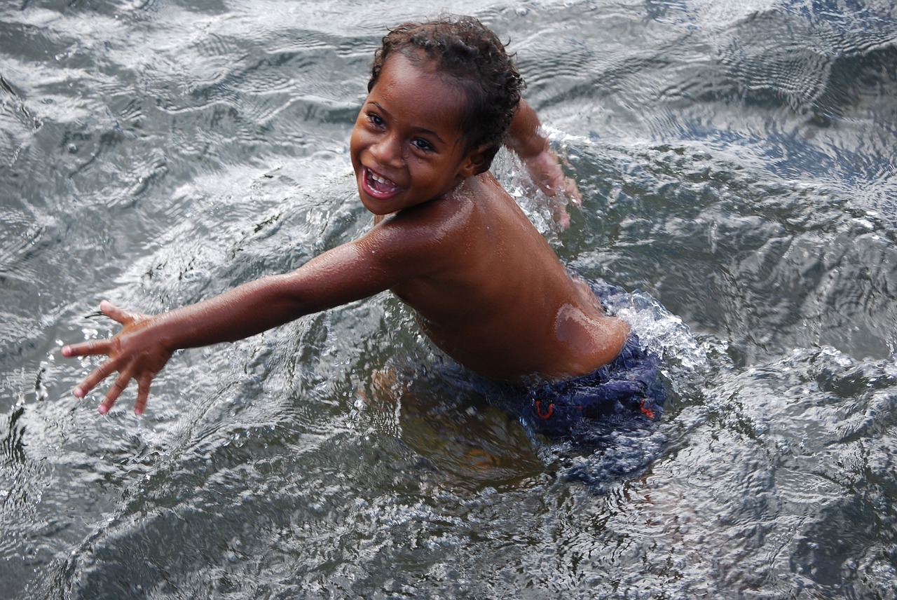 child swimming smile free photo