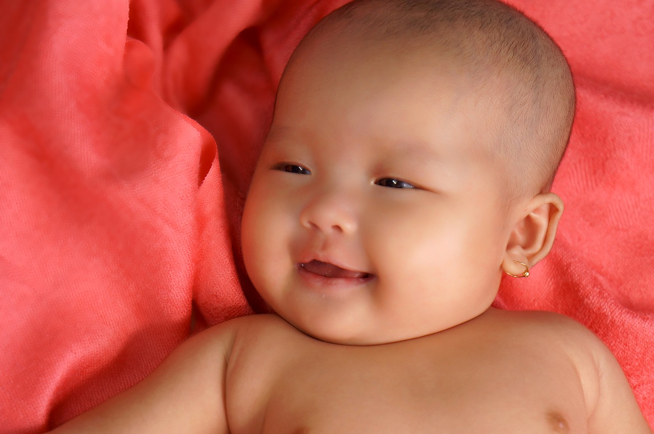 Yang baby. Newborn Baby smile. Baby smiling.