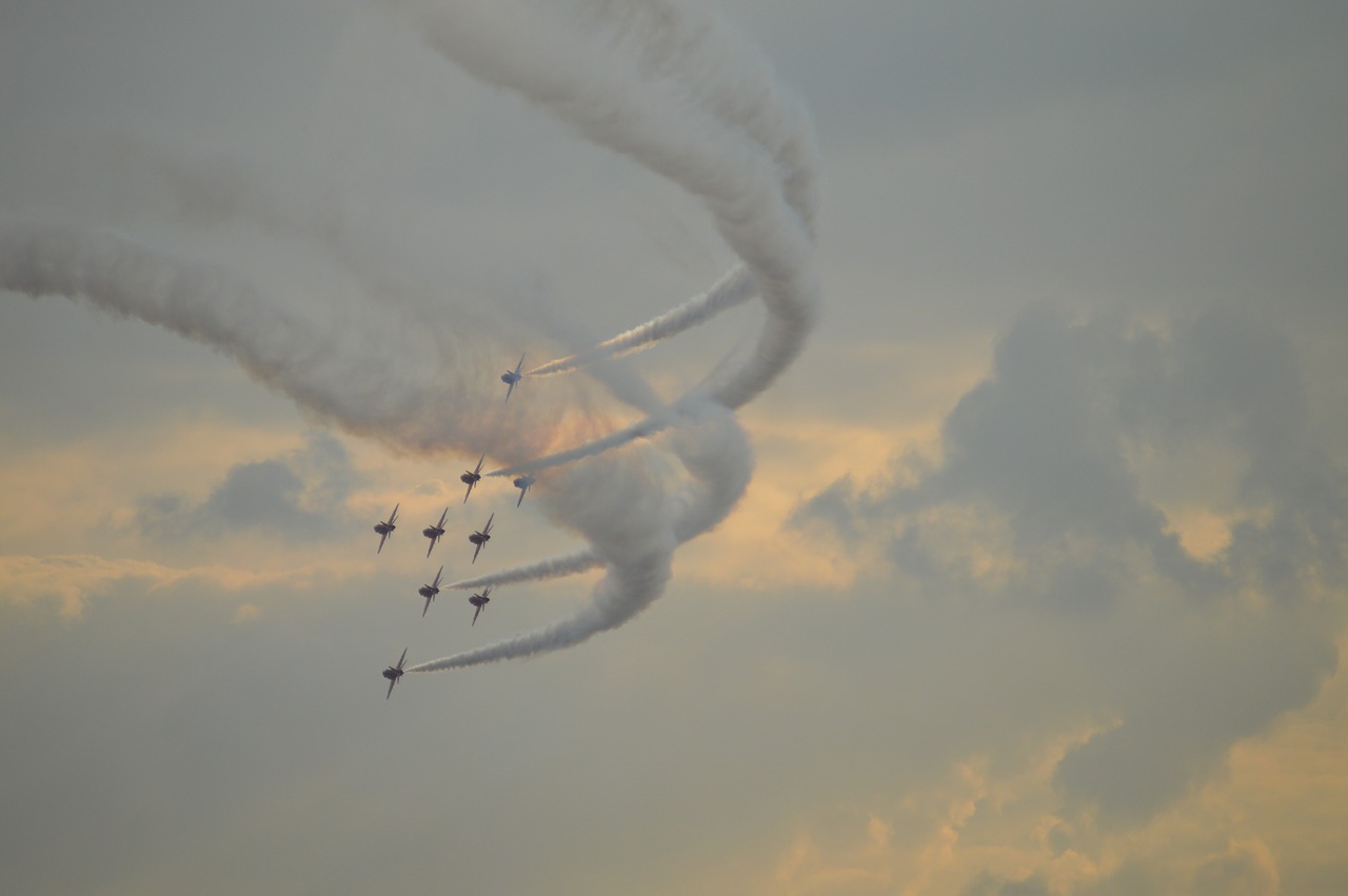 smoke trails red arrows stormy free photo