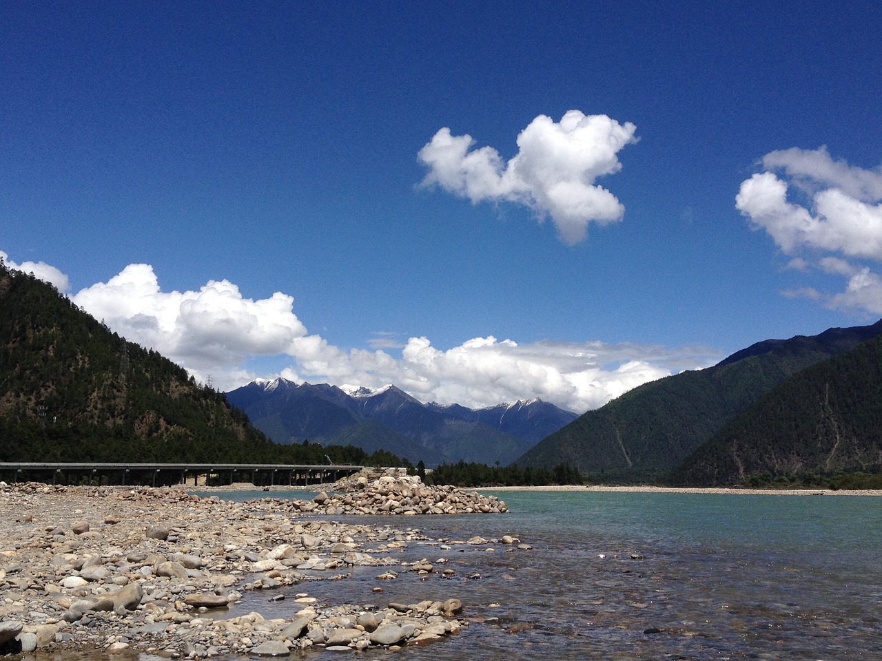 snow-capped mountains river riverside mountain free photo