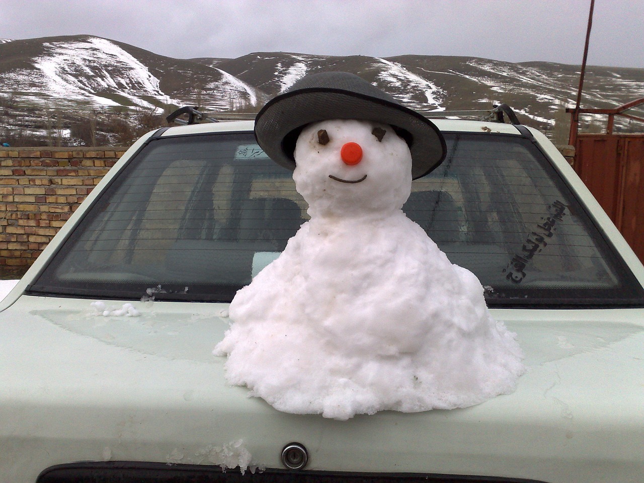 snow man mountain village free photo