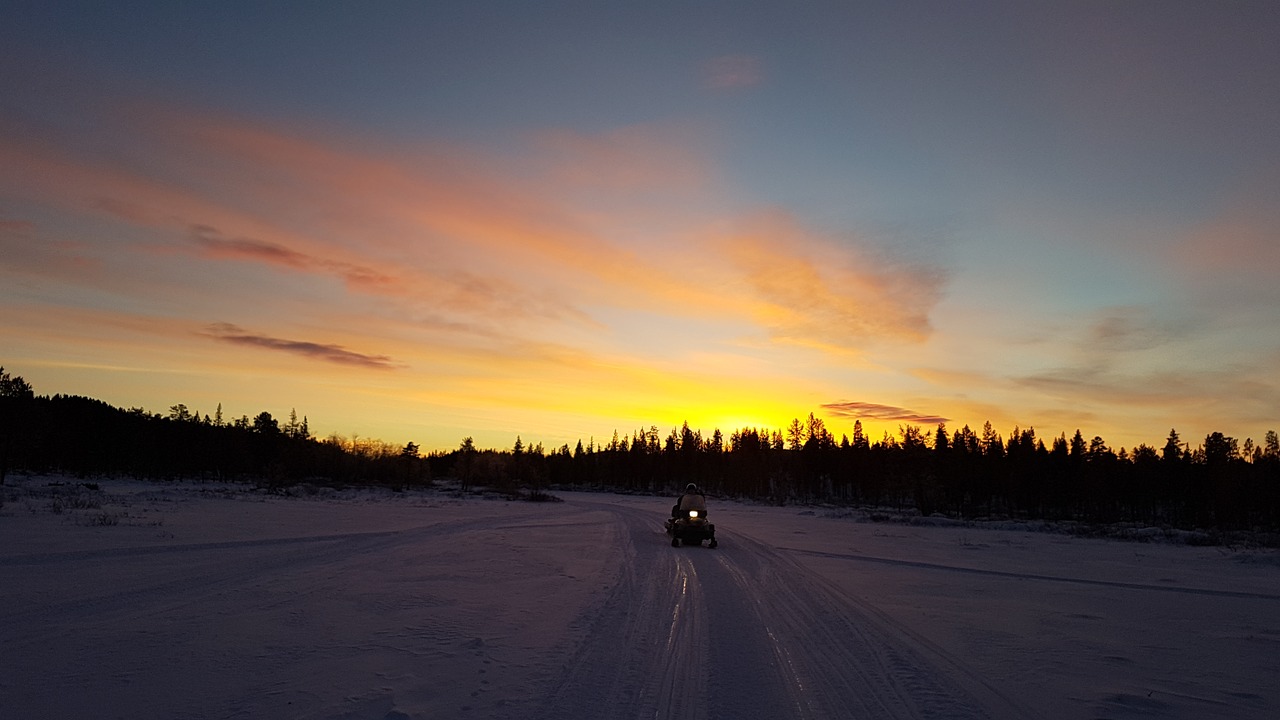 snowmobile  sunrise  sweden free photo