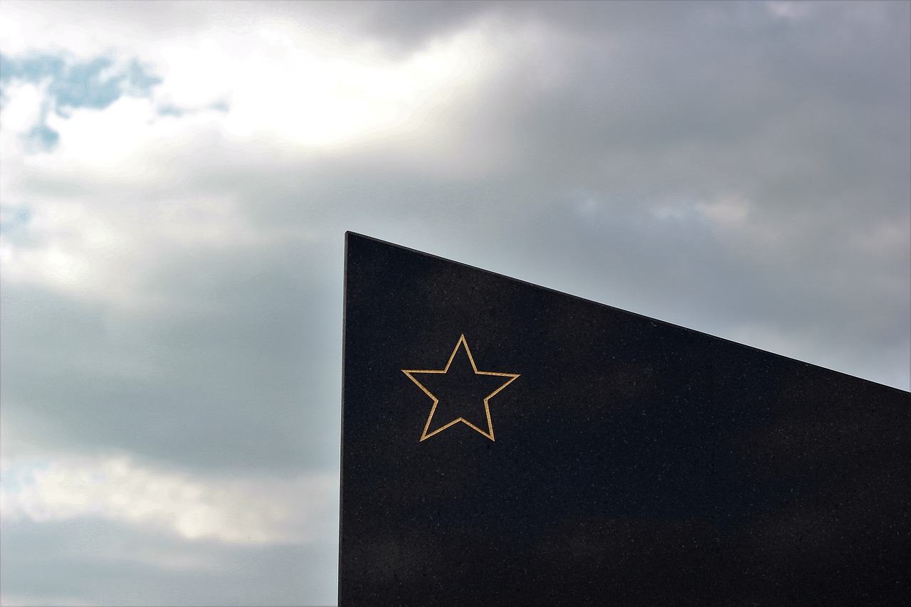 socialist monument gold star black marble free photo