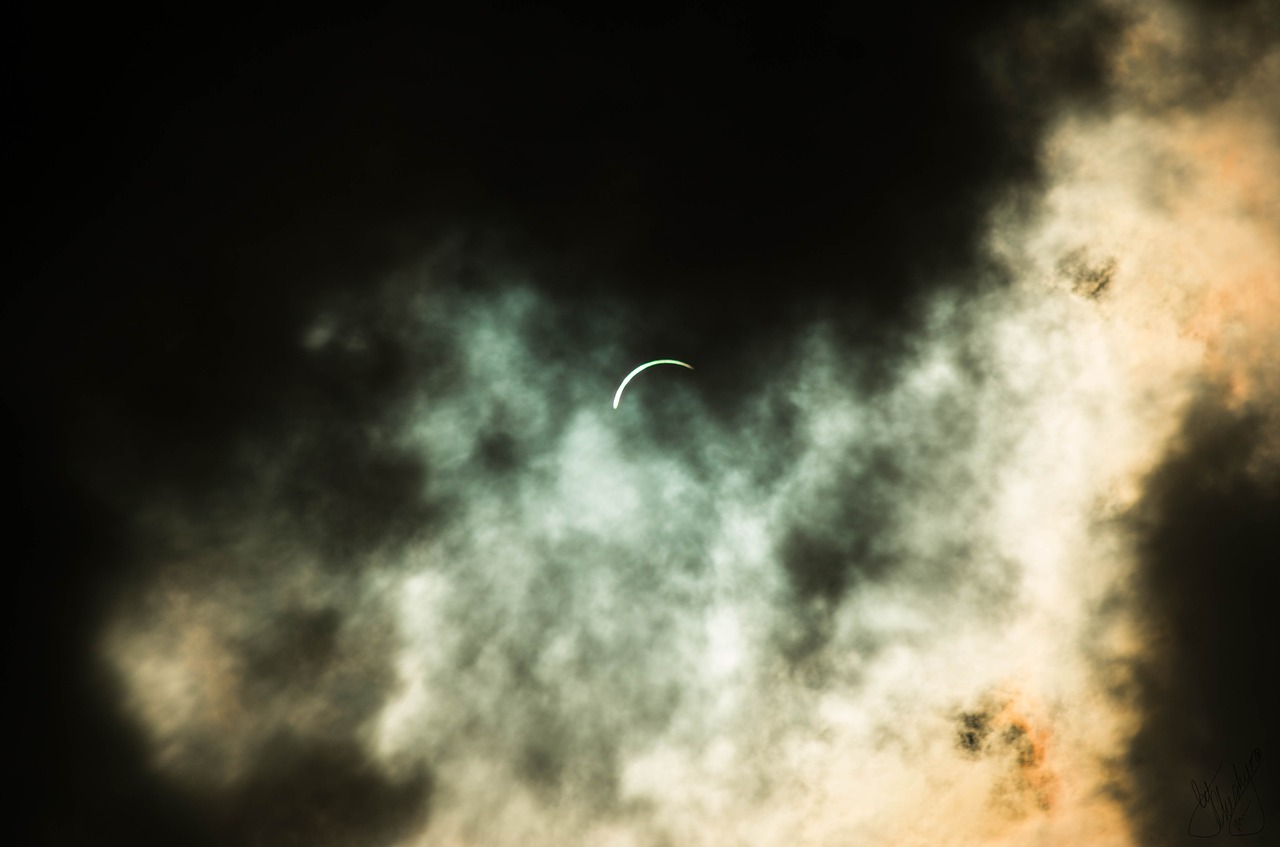 solar eclipse sun clouds free photo
