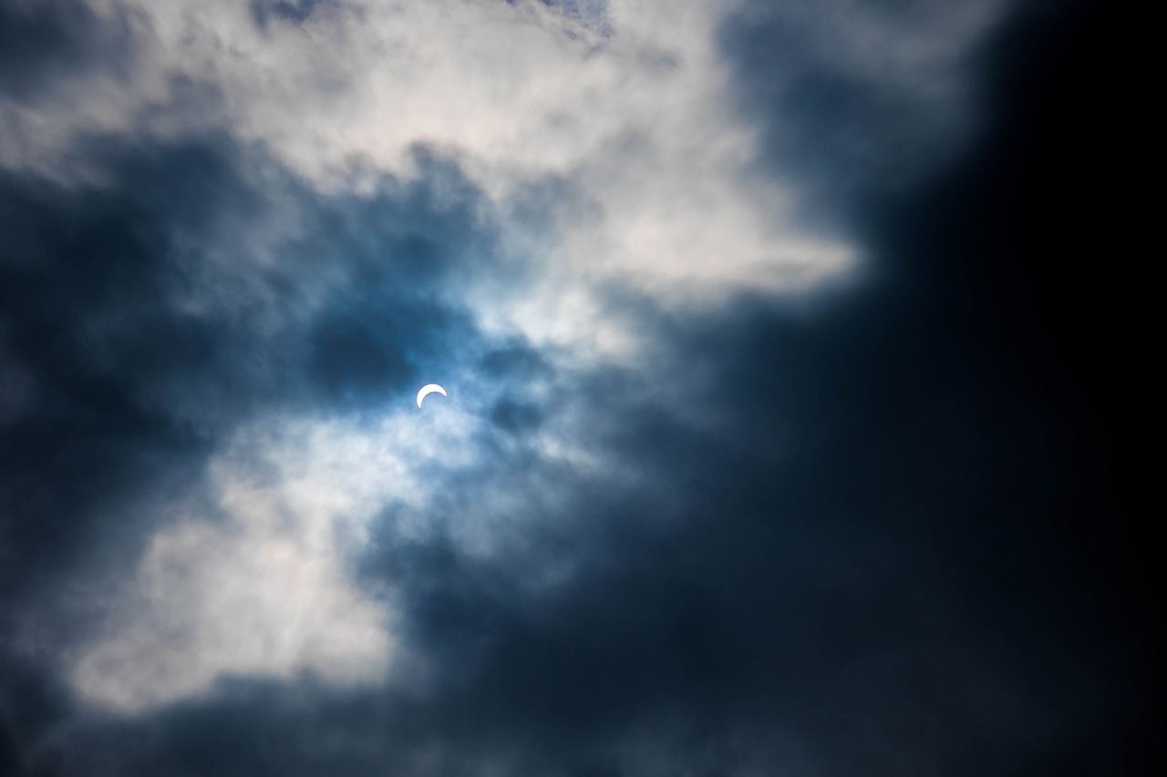 solar eclipse clouds sky free photo